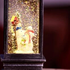 11 In. Tall Snowman Lantern Snow Globe With Warm White LED Light, Silver -Christmas Decor Shop alpine corporation christmas novelty lights qva126sl 76 1000