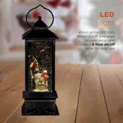 11 In. Tall Snowman Lantern Snow Globe With Warm White LED Light, Silver -Christmas Decor Shop alpine corporation christmas novelty lights qva126sl a0 1000