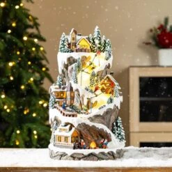 15.50 In. Lighted Skiing Moutain Resin Christmas Village With Movement And Music -Christmas Decor Shop glitzhome christmas villages 2040200001 31 1000
