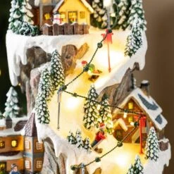 15.50 In. Lighted Skiing Moutain Resin Christmas Village With Movement And Music -Christmas Decor Shop glitzhome christmas villages 2040200001 fa 1000