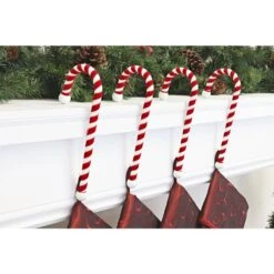 9 In. Steel Core Red And White Candy Cane Stocking Holder (4-Pack) -Christmas Decor Shop haute decor stocking holders cc0403 c3 1000